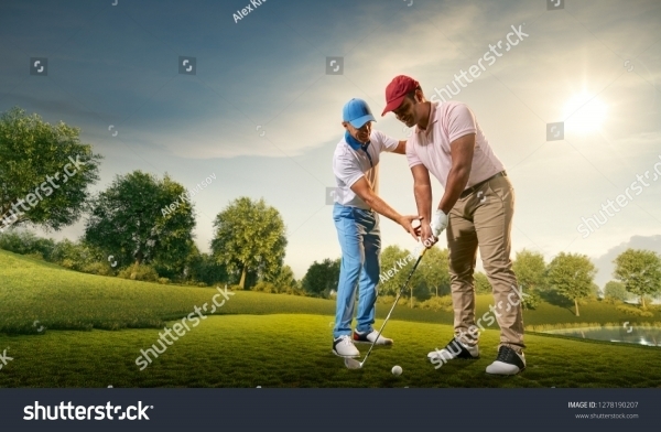 stock-photo-male-golf-players-on-professional-golf-course-golfer-teaches-to-play-golf-1278190207